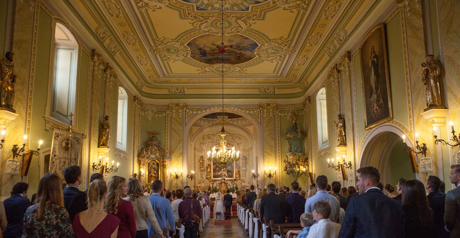 Wedding ceremony in a beautiful Christian church interior.
