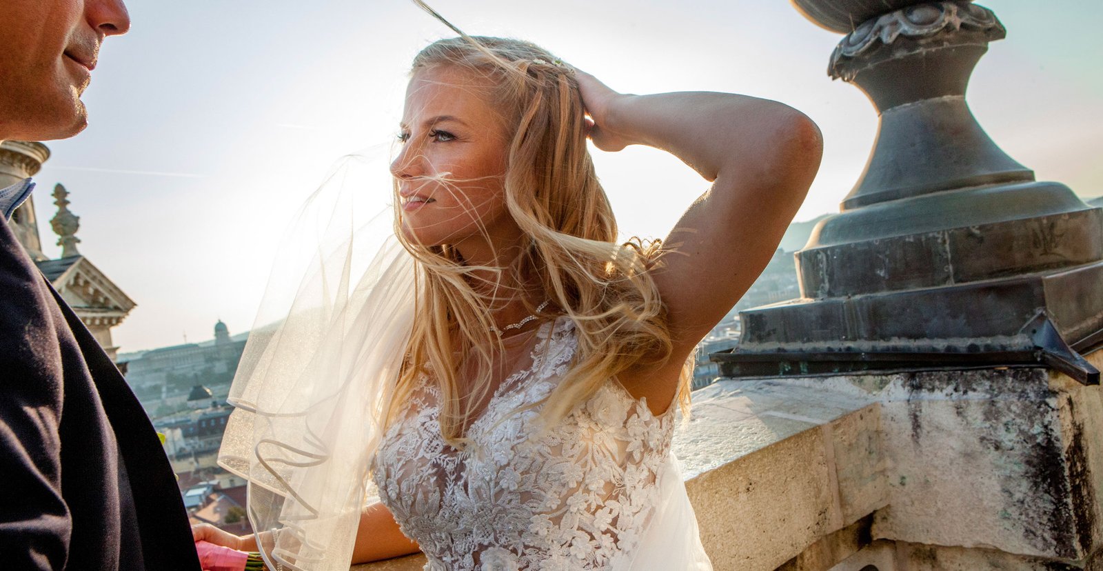 A beautiful bride looks at the groom with admiration.